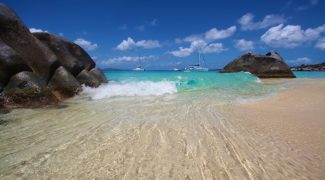 The beauty of Spring Bay National Park on Virgin Gorda surrounds the visitor with turquoise waters, palm trees, and magnificent boulders in an unspoiled setting. – Photo courtesy Johnna Rice